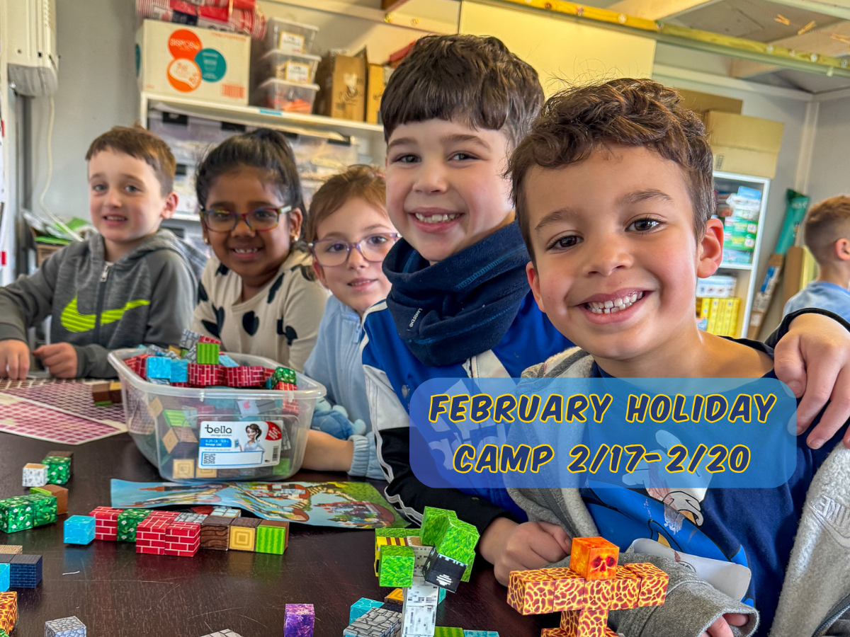 Smiling children build with colorful blocks during February Holiday Camp at Rolling River Day Camp.
